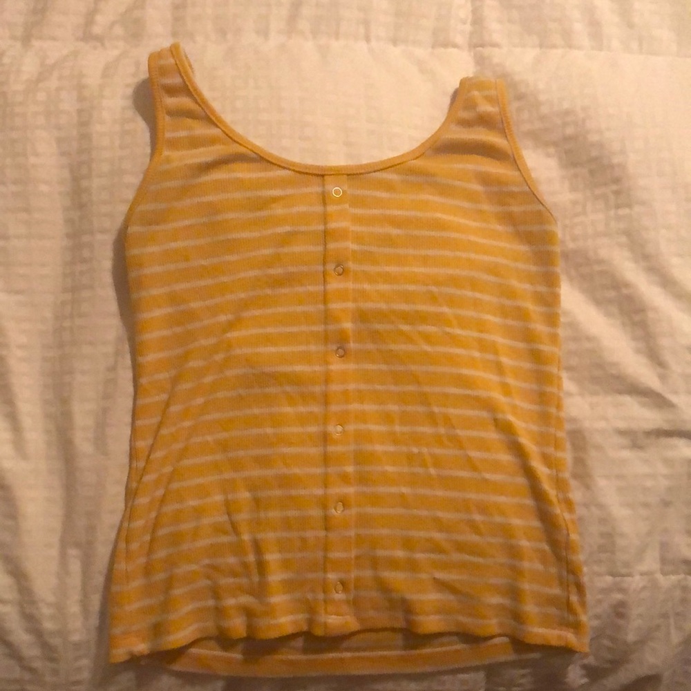 Yellow shirt with white stripes with buttons for design.